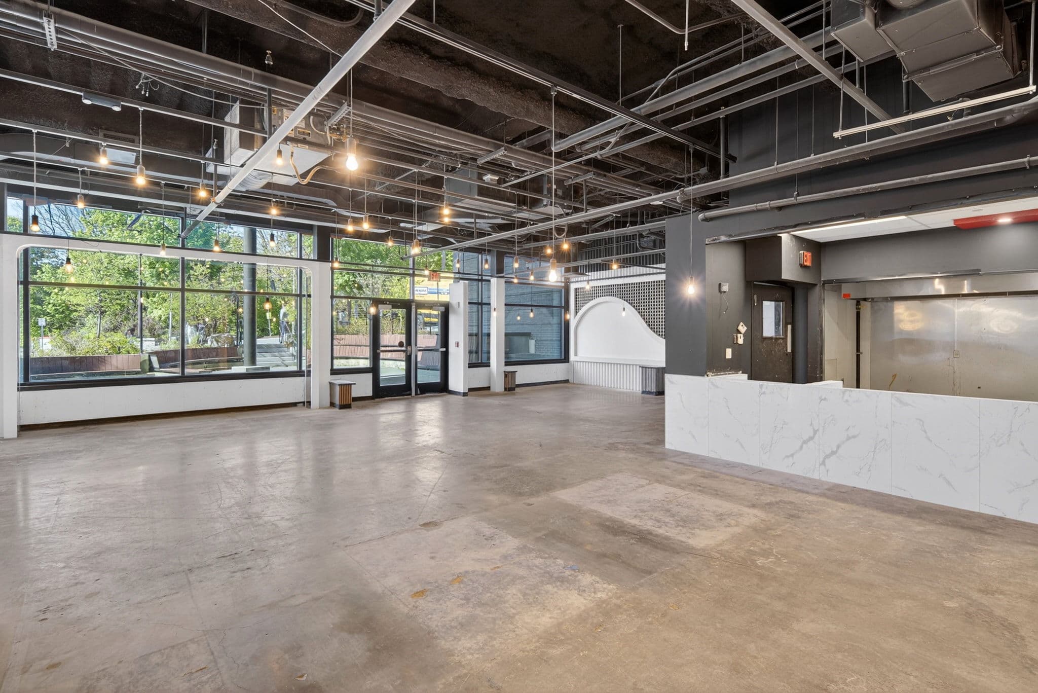 Bar rail and lounge seating zones (as-is)